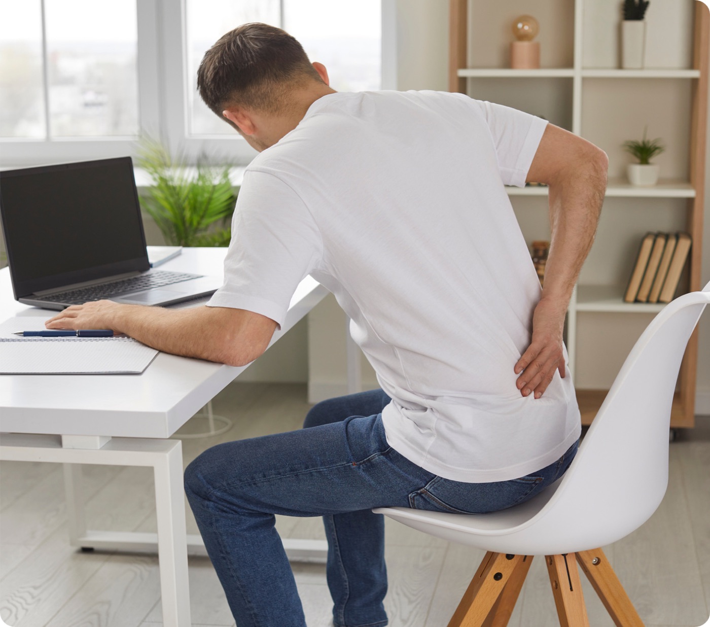 Desk worker feeling discomfort after sitting