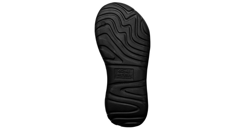 Textured outsole of an I-Revive recovery slide